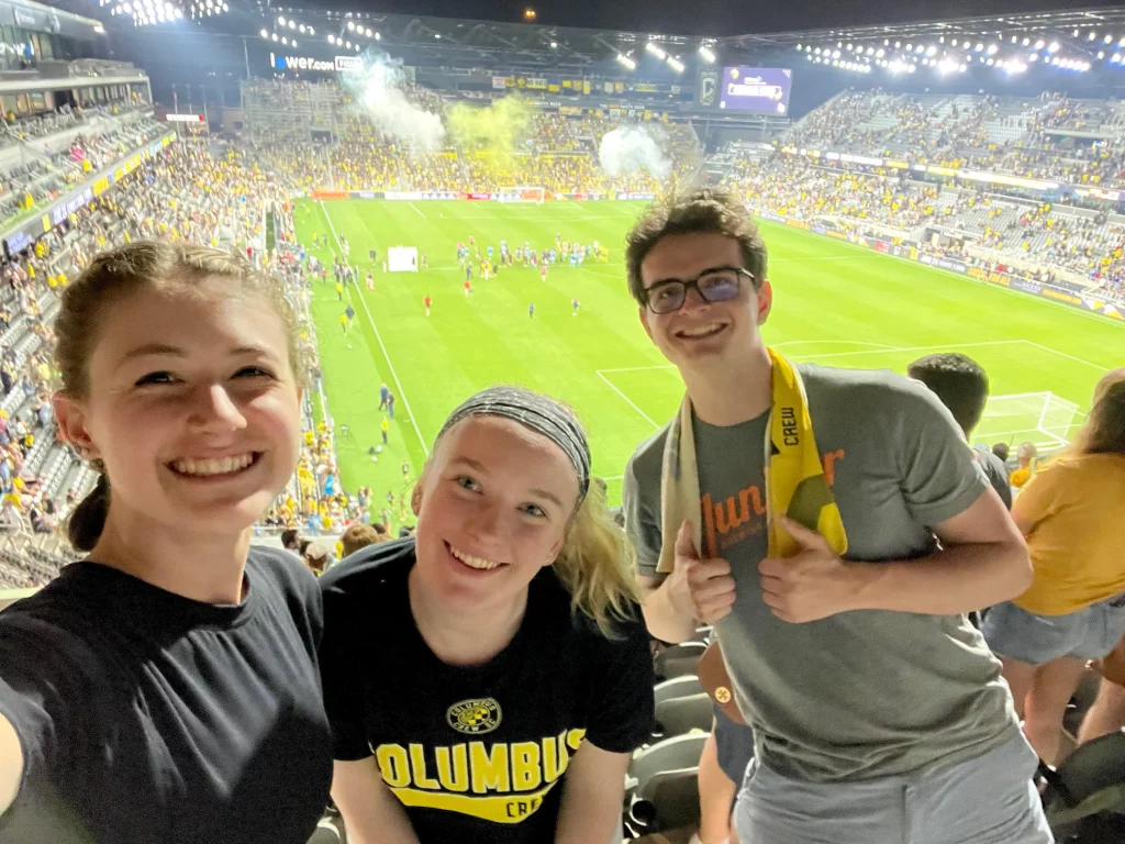 Allison Plachta with friends at a game