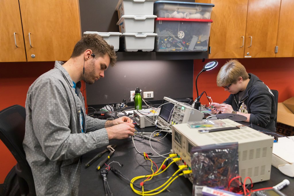 Electrical engineering students apply their skills to hands-on work.