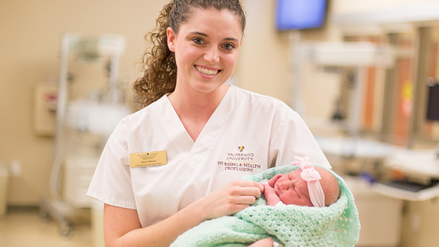 A student learns to care for infants in the College for Health Care Professionals
