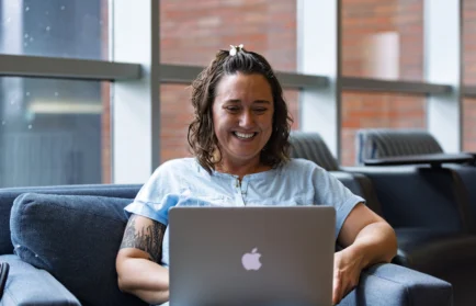 Online Valpo Graduate student working on laptop.