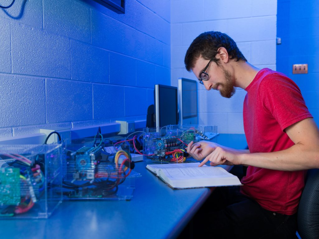 EPIC Student Cody Packer works on Computer Science research with