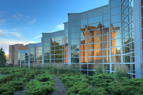 The Chapel of the Resurrection shines off of the VU Center for the Arts