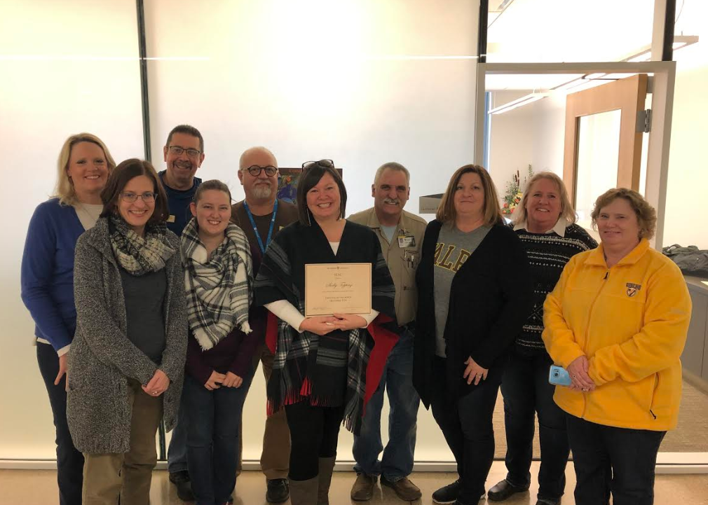 SEAC members present Shelby Topping with December 2018 Employee of the Month award!