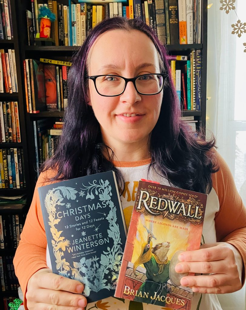 Rachel Myszkiewicz holding two books.