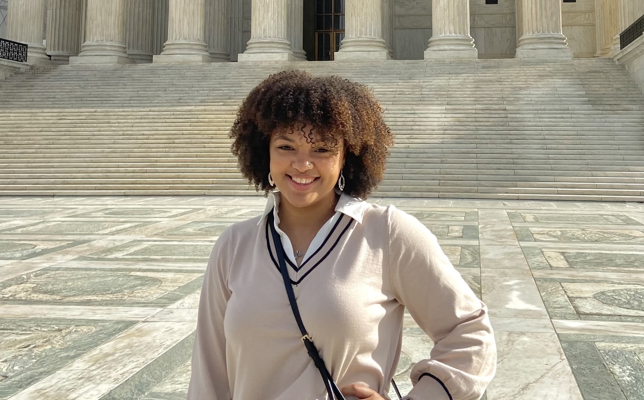 Kayla Smith '24 smiling in front of a government building in Washington, D.C.