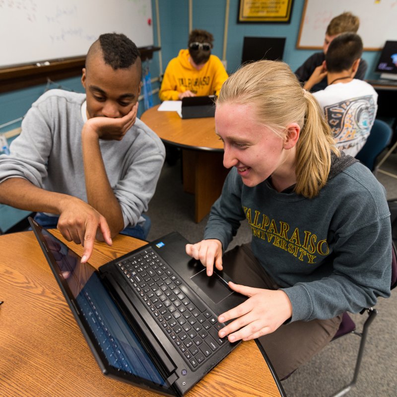 two students working on a computer