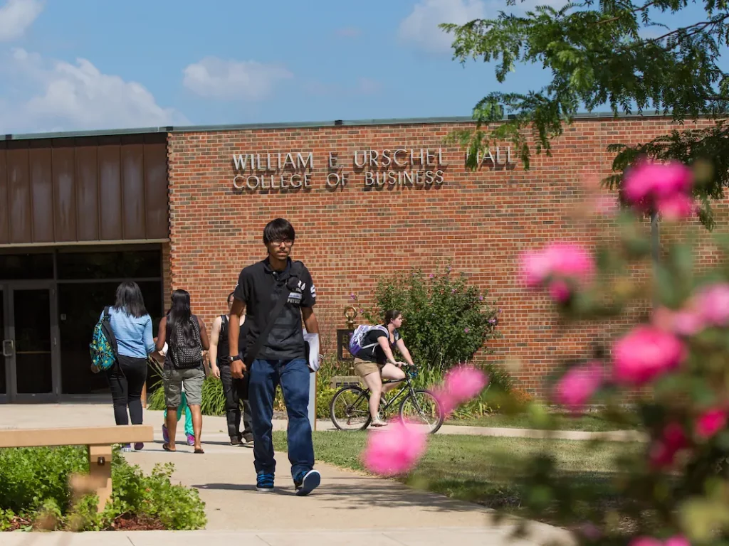 A Valpo student wearing a yellow polo shirt.