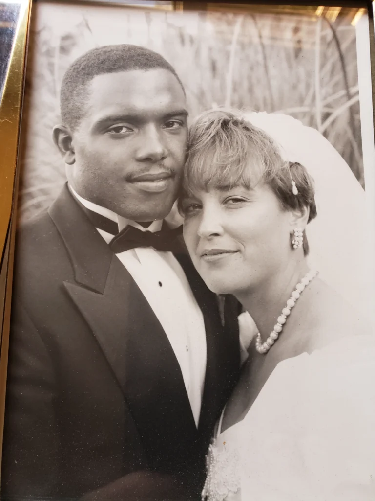 A bride and groom pose close together, smiling softly in a black and white wedding portrait by Kim Wagner at Beacon, perfectly capturing their joy.