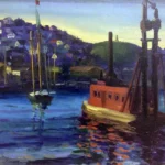 A red boat and sailboat on a blue harbor, with houses on a hillside in the background at sunset.