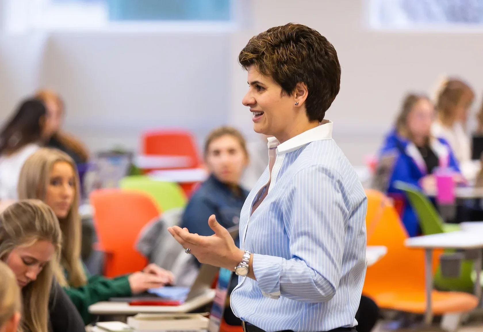A Valparaiso University health science professor speaks to a group of students in a classroom.