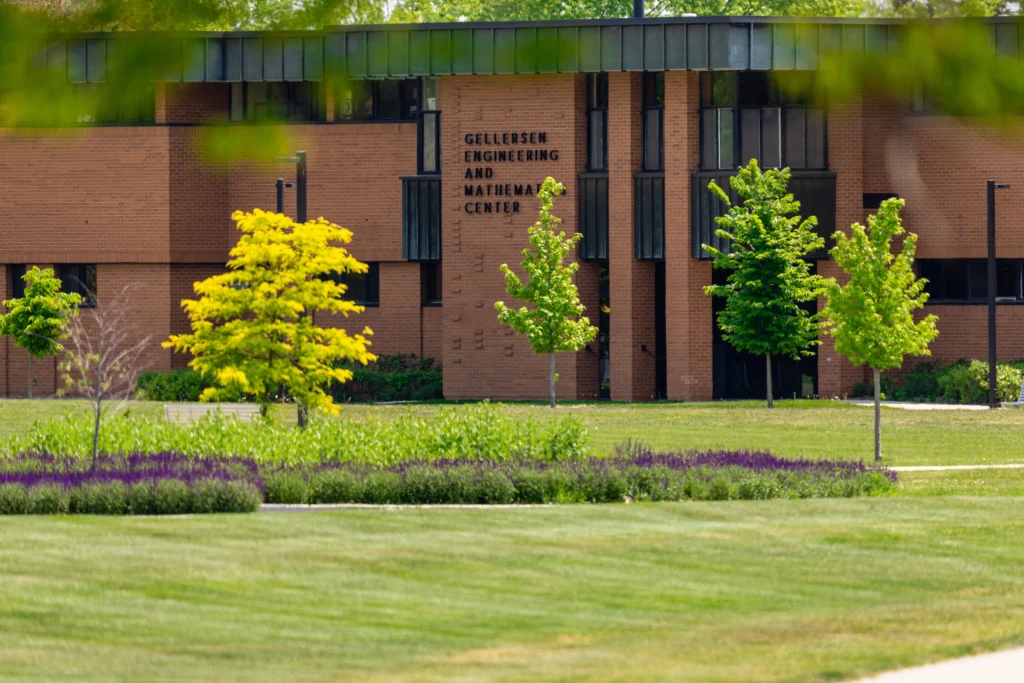 Brick building with “Gellersen Engineering and Mathematics Center” sign, surrounded by trees and green lawn, serves as a hub for the Valpo community, especially those pursuing studies in Computer Engineering.